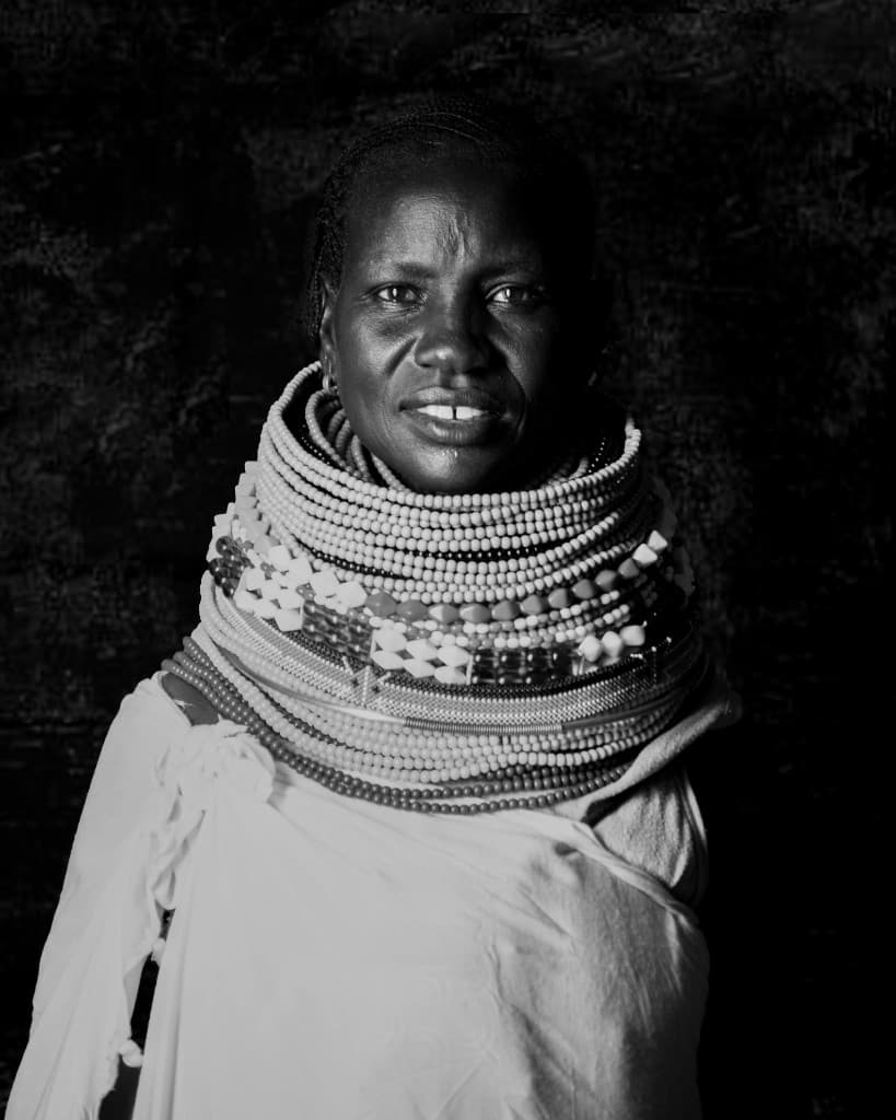 Maasai woman in traditional beaded collar, black and white portrait