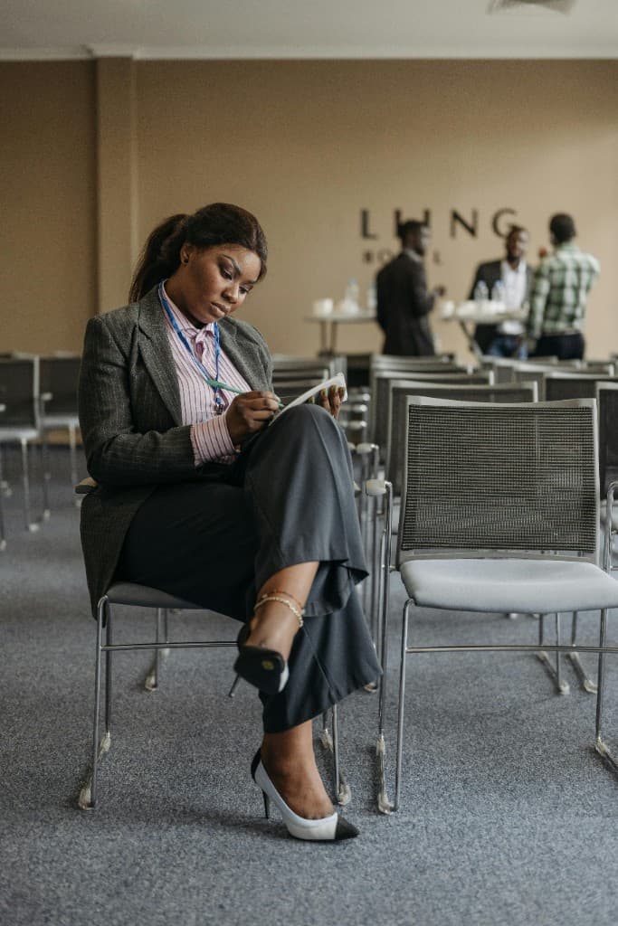 Woman taking notes at a summit