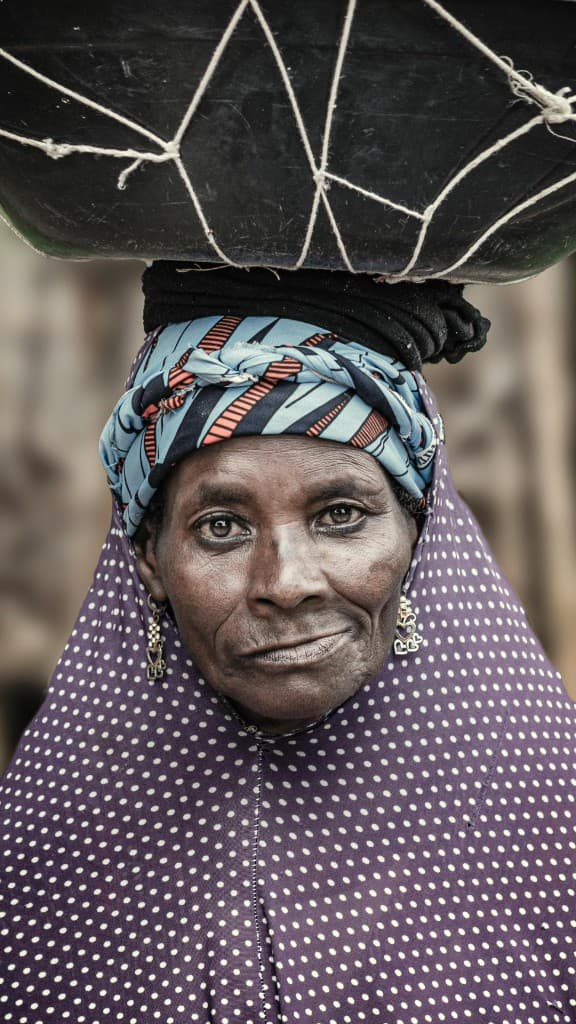 Woman in vibrant traditional headwrap